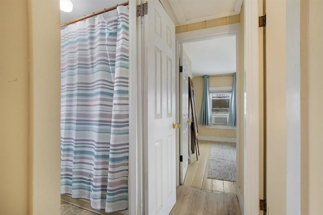 bathroom featuring cooling unit and wood finished floors