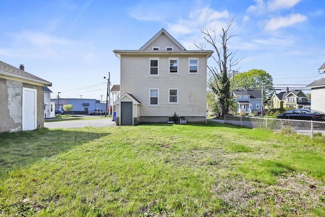 back of property featuring a residential view
