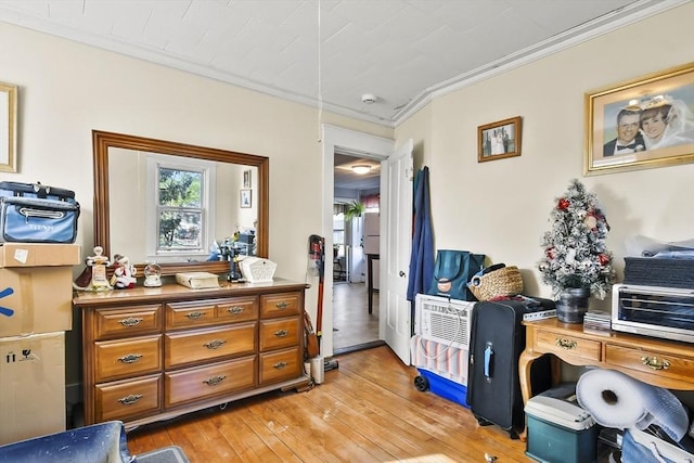 misc room featuring ornamental molding and light wood finished floors