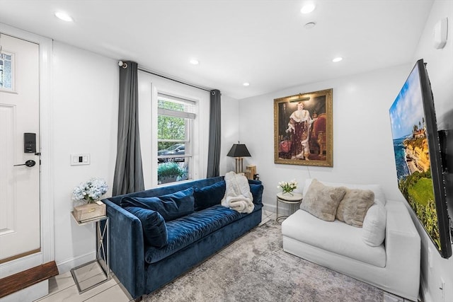 living room featuring baseboards and recessed lighting
