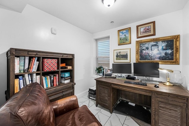 office space featuring light marble finish flooring and baseboards