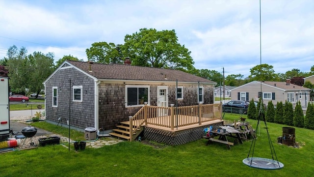 62 Greenbrier Dr, New Bedford, MA 02745 - rear view of property featuring a yard, a wooden deck, and a chimney