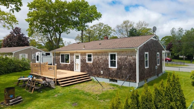 62 Greenbrier Dr, New Bedford, MA 02745 - rear view of property with a lawn, a deck, a chimney, and a shingled roof