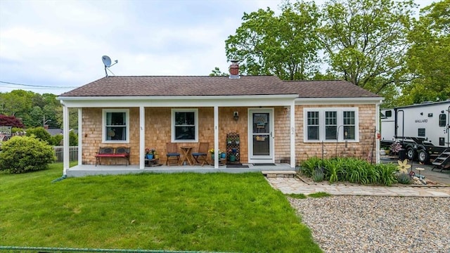 62 Greenbrier Dr, New Bedford, MA 02745 - view of front facade with a front lawn, covered porch, a chimney, and a shingled roof