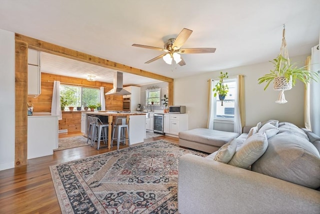 62 Greenbrier Dr, New Bedford, MA 02745 - living room with light wood-type flooring, wine cooler, and a ceiling fan