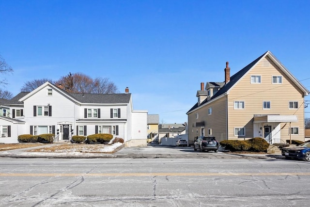 view of road featuring a residential view, curbs, and sidewalks