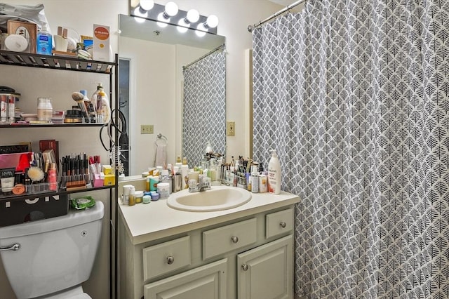 bathroom featuring vanity and toilet