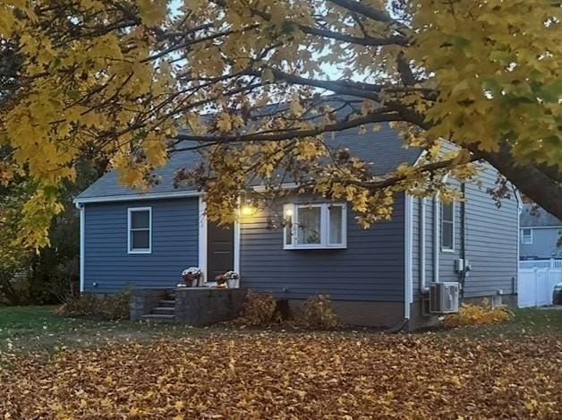 rear view of house with central AC unit