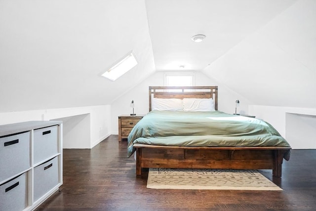 bedroom featuring lofted ceiling with skylight and dark wood-style flooring