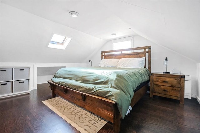 bedroom with lofted ceiling with skylight and dark wood-type flooring