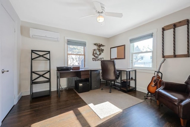 home office with dark wood-style floors, an AC wall unit, ceiling fan, and baseboards