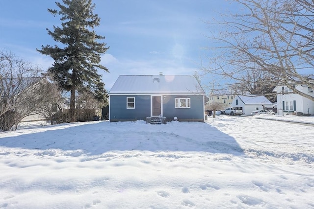 snow covered house with entry steps