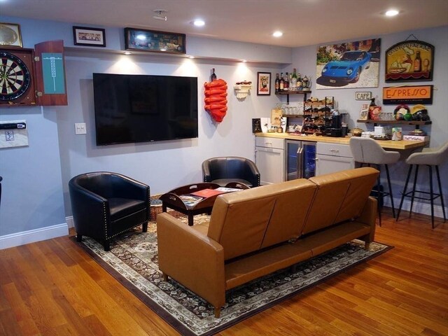 4 Bluebird Ln Unit 4, Killingly, CT 06241 - living room with a bar, beverage cooler, wood finished floors, baseboards, and recessed lighting