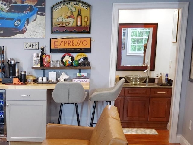 4 Bluebird Ln Unit 4, Killingly, CT 06241 - indoor bar with wood finished floors and beverage cooler