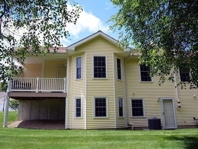 4 Bluebird Ln Unit 4, Killingly, CT 06241 - rear view of property featuring a lawn and central AC