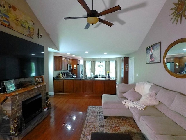 4 Bluebird Ln Unit 4, Killingly, CT 06241 - living area with light wood-style floors, a ceiling fan, a stone fireplace, recessed lighting, and high vaulted ceiling