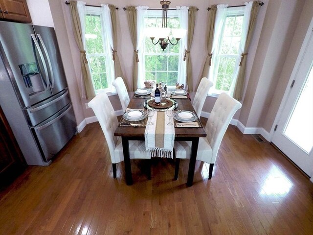 4 Bluebird Ln Unit 4, Killingly, CT 06241 - dining room with a chandelier, wood finished floors, and baseboards