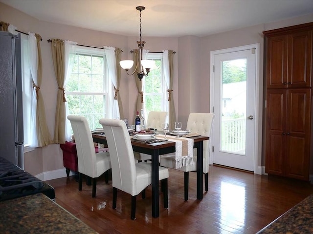 4 Bluebird Ln Unit 4, Killingly, CT 06241 - dining space featuring a chandelier, wood finished floors, and baseboards