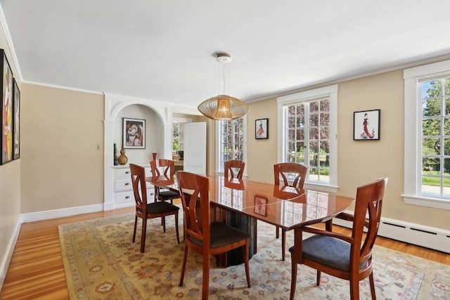 10 Orchard Rd, Gloucester, MA 01930 - dining room featuring light wood finished floors, healthy amount of natural light, baseboards, and ornamental molding