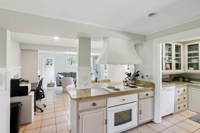 10 Orchard Rd, Gloucester, MA 01930 - kitchen featuring white appliances, exhaust hood, a peninsula, light tile patterned flooring, and open floor plan
