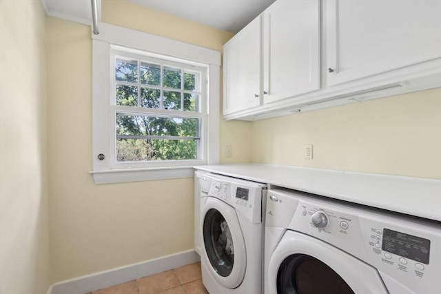 10 Orchard Rd, Gloucester, MA 01930 - washroom with cabinet space, washer and clothes dryer, baseboards, and light tile patterned floors