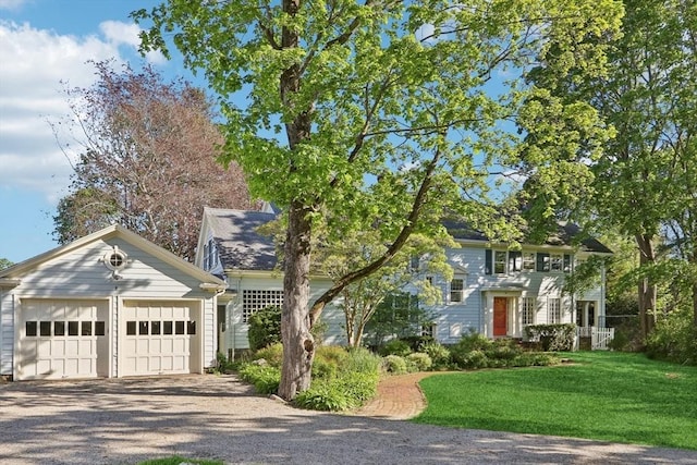 10 Orchard Rd, Gloucester, MA 01930 - colonial house with gravel driveway, an outbuilding, a front yard, and an attached garage