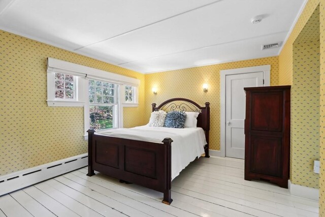10 Orchard Rd, Gloucester, MA 01930 - bedroom featuring wallpapered walls, baseboard heating, light wood-type flooring, and baseboards