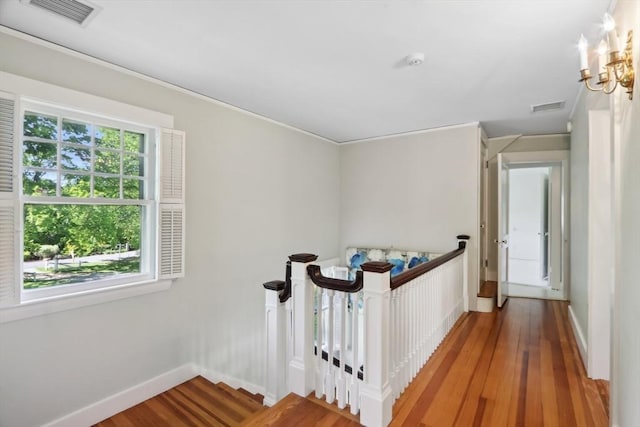 10 Orchard Rd, Gloucester, MA 01930 - hall with wood finished floors, baseboards, an upstairs landing, and a chandelier