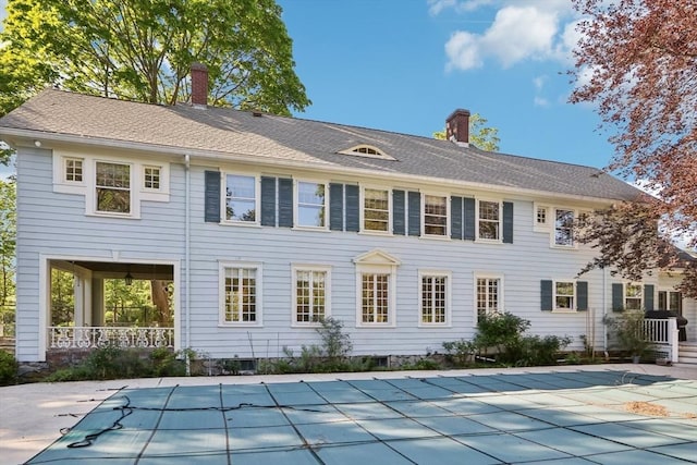 10 Orchard Rd, Gloucester, MA 01930 - rear view of house featuring a chimney and a covered pool