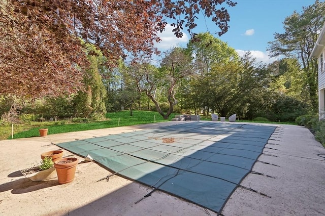 10 Orchard Rd, Gloucester, MA 01930 - view of pool featuring a patio, a covered pool, and view of wooded area