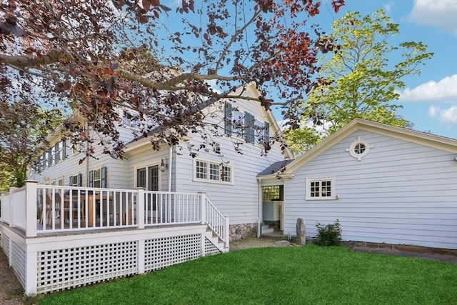 10 Orchard Rd, Gloucester, MA 01930 - back of property featuring a lawn and a wooden deck