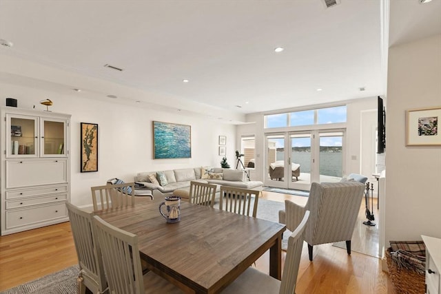 dining space featuring recessed lighting, visible vents, and light wood-style floors