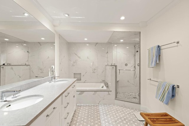 full bath with crown molding, a garden tub, a marble finish shower, and a sink