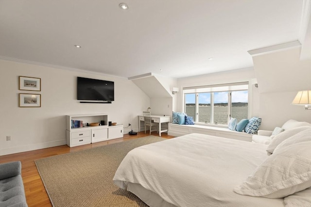 bedroom with crown molding, recessed lighting, wood finished floors, and baseboards