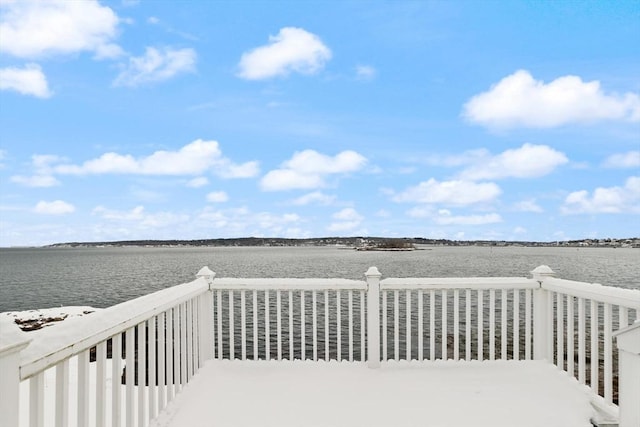 wooden terrace with a water view