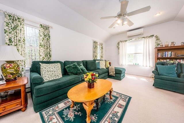 carpeted living area featuring lofted ceiling, a wall unit AC, a ceiling fan, and baseboards