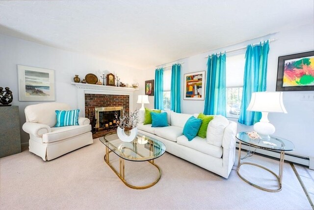 carpeted living room with a baseboard heating unit and a fireplace
