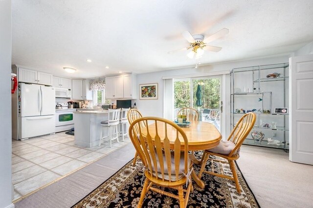 dining space featuring a healthy amount of sunlight, a ceiling fan, and recessed lighting