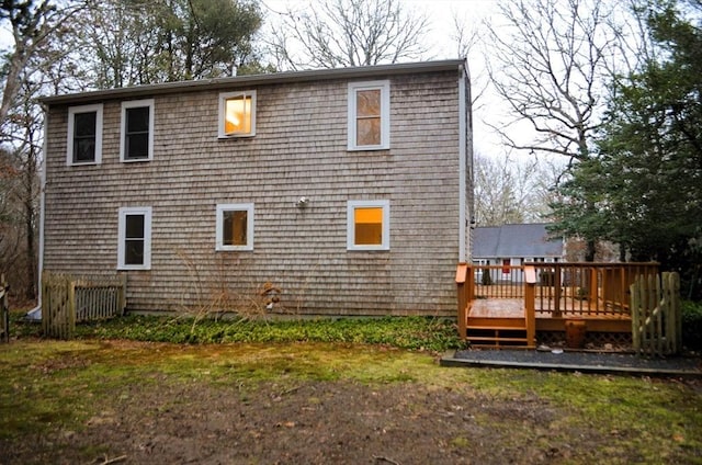 back of house with a wooden deck