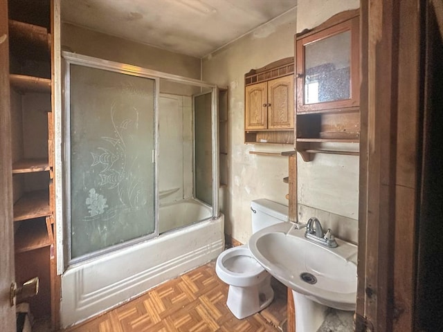 233 Grove St, Woonsocket, RI 02895 - bathroom featuring toilet and bath / shower combo with glass door