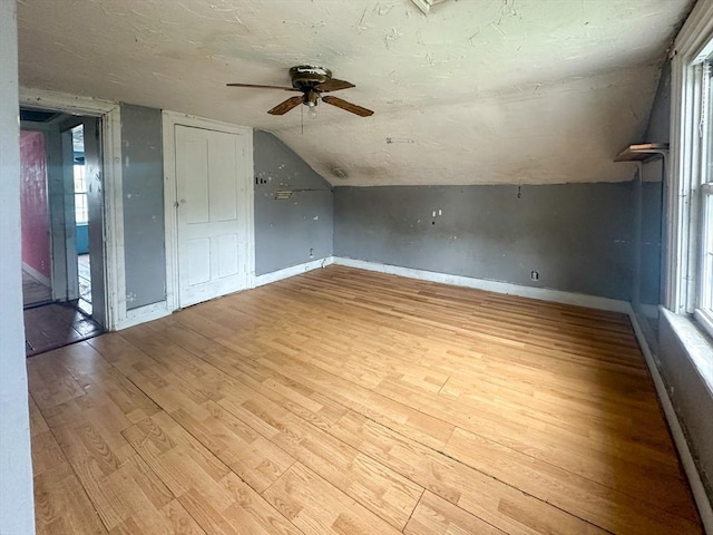 233 Grove St, Woonsocket, RI 02895 - additional living space with ceiling fan, vaulted ceiling, light wood-style flooring, and baseboards