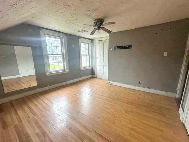 233 Grove St, Woonsocket, RI 02895 - bonus room featuring ceiling fan, lofted ceiling, light wood-style floors, and baseboards