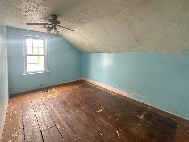 233 Grove St, Woonsocket, RI 02895 - bonus room featuring wood-type flooring, vaulted ceiling, ceiling fan, a textured ceiling, and baseboards