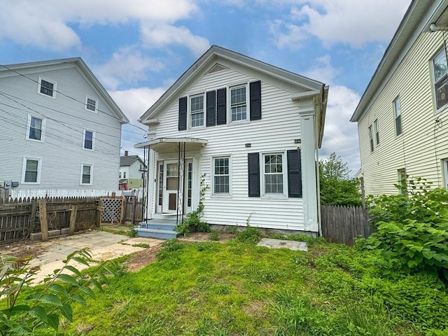 233 Grove St, Woonsocket, RI 02895 - rear view of property with a patio area