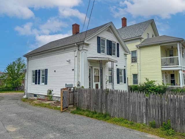 233 Grove St, Woonsocket, RI 02895 - view of home's exterior featuring a chimney