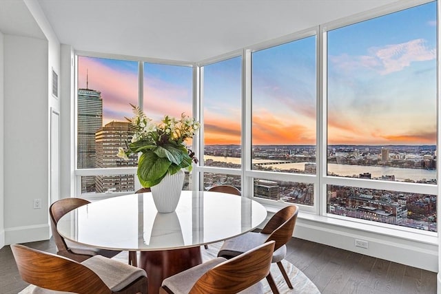 sunroom / solarium with visible vents and a city view