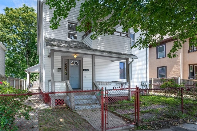72 Hall St, Springfield, MA 01108 - view of front facade featuring a porch, a gate, and a fenced front yard