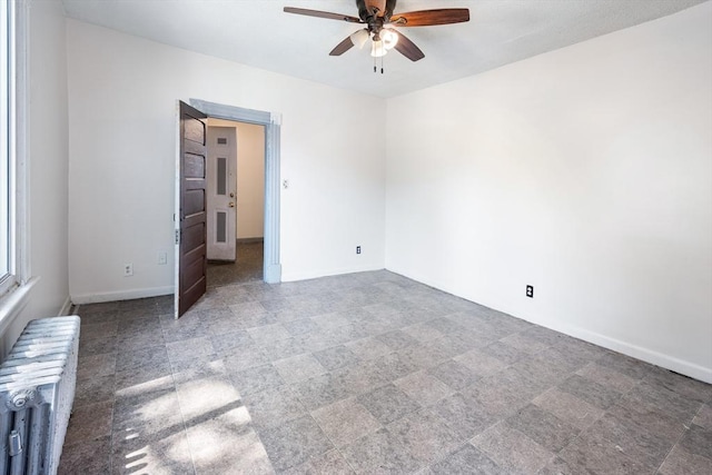 72 Hall St, Springfield, MA 01108 - unfurnished room featuring radiator heating unit and ceiling fan