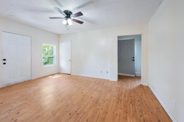 72 Hall St, Springfield, MA 01108 - unfurnished room featuring light wood-style floors, a ceiling fan, and a textured ceiling
