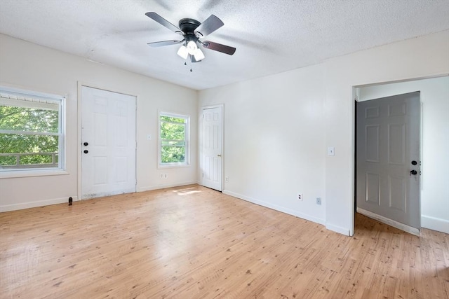 72 Hall St, Springfield, MA 01108 - empty room with light wood-type flooring, ceiling fan, and a textured ceiling